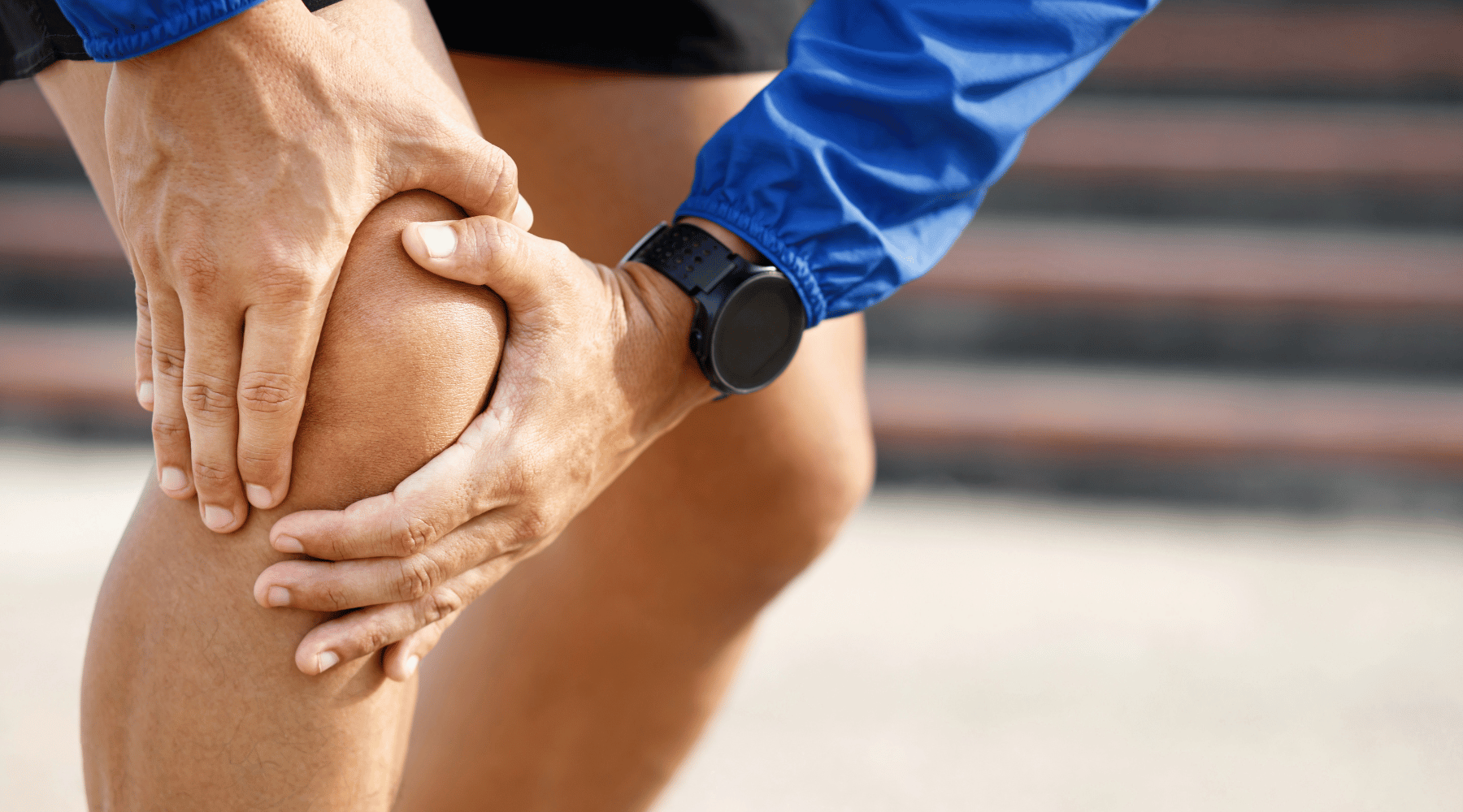 Runner holding their knee and needing Rose-Hip Vital for Joint Pain