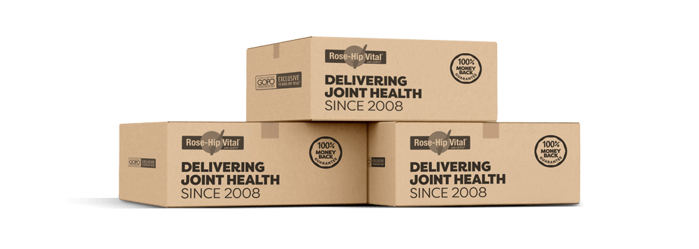 Three cardboard boxes with 'Rose-Hip Vital' branding on a black background