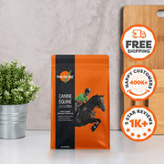 Rose-Hip Vital refill bag with horse and rider graphic, potted plant, and wooden board on gray surface